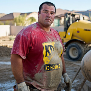 Michael Angelucci a Caucasian Latino concrete mixer operator pou...