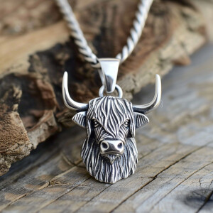 Beautiful sterling silver pendant featuring a highland cow desig...