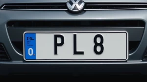 a licensed plate that says PL8 on it