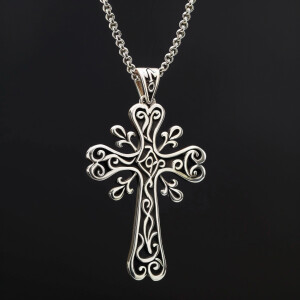 Sterling silver cross pendant featuring intricate design with in...