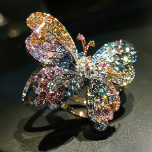 Exquisite butterfly ring adorned with colorful shimmering diamon...