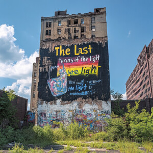 Weathered-graffiti, a skyscraper with a crumbling wall from an a...