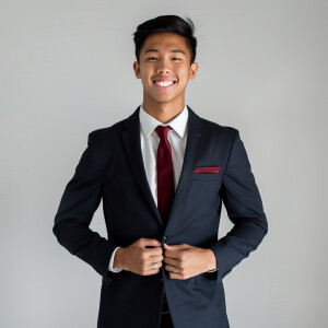 A man wearing a suit.
The Suit Color is navy blue
The Tie Colo...