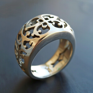 Design a sterling silver ring with intricate cross cutouts for a...