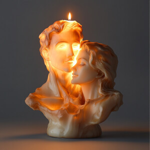 there is a candle that is shaped like a head of a man and a woma...