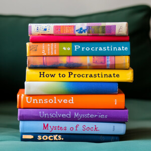 A colorful stack of assorted-height books with spines displaying...