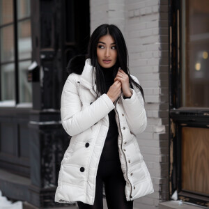 Photo of fair skinned hourglass figure woman with dark straight...