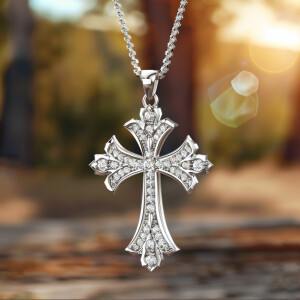 Design an elegant and intricate cross pendant adorned with spark...