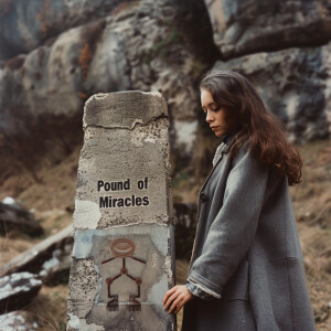 A realistic faded film photograph from 1968 of a beautiful, frec...