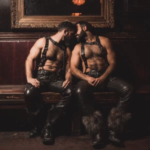 Create an image of two beefy men both black hair and beard weari...