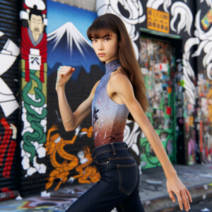 Very thin Athletic Thin skinny Attractive, Asian teenage girl, long brown hair and bangs, wearing tight skinny jeans and a halter top paint marks on her clothing, sitting side view heroic pose Asian graffiti