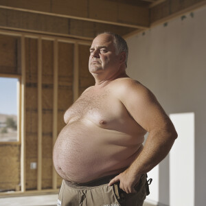 Hyperrealistic photo of Curtis Kowe who is employed as apainting...