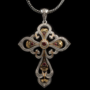 Elegant sterling silver cross pendant featuring a stunning gold...