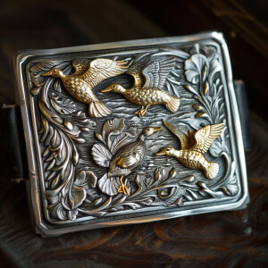 Handmade sterling silver trophy buckle featuring smooth sterling...