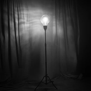 An isolated ghost light stands on a five-foot-tall stand, castin...