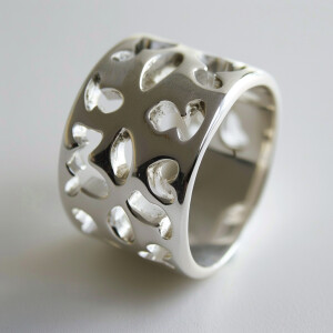 Design a sterling silver ring with intricate cross cutouts for a...