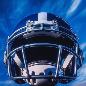 Captured at eye-level on a vibrant day, a close-up of a football...