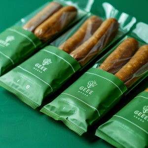 Create an eye-catching packaging concept for 'Green Meet' vegan...