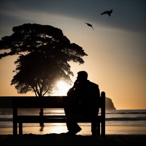 a man sitting on the beach