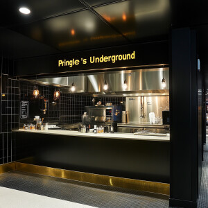 Modern upscale restaurant called “Pringle’s Underground Kitchen,...