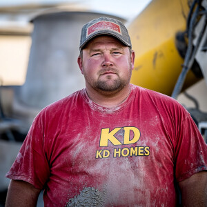 Curtis Kowe a concrete mixer operator pouring concrete, he is no...