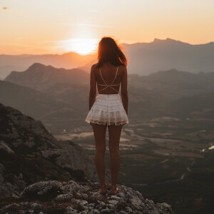 Photo of brunnette girl wearing white short sun dress standing o...