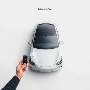 A pristine white background. A premium, sleek rental car (Tesla...