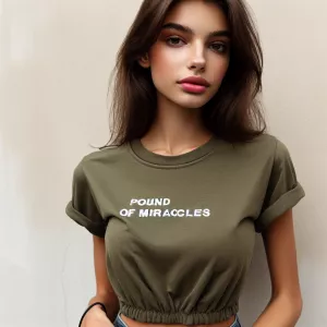 Beautiful thin 19-year-old woman wearing an olive T-shirt with t...