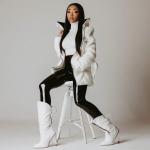 Photo of fair skinned hourglass figure woman with dark straight...