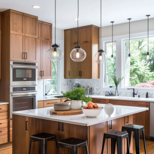 Design a transitional style kitchen with sleek wood cabinets and...