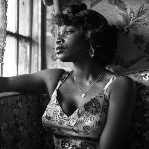 A black transgender woman in 1950s dress