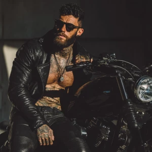 A sharply groomed man with a meticulously styled short haircut a...