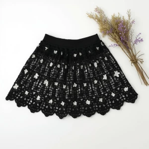 Create an elegant flat lay composition featuring a delicately ha...