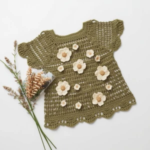 Create an elegant flat lay composition featuring a delicately ha...