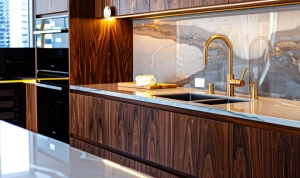 “Contemporary kitchen with walnut wood cabinets, under-cabinet l...