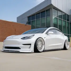 White tesla model 3 performance edition with bbs lm lowered