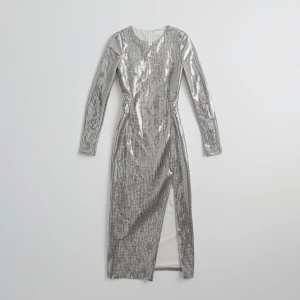 Create a minimalist flat lay composition with a couture silver s...