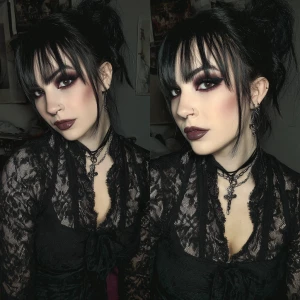 Create an image of a goth girl with dark makeup,