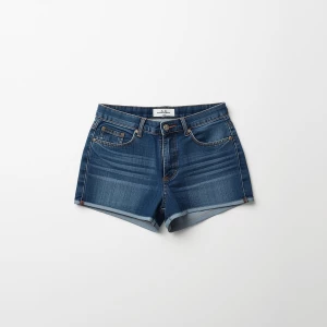 Create a minimalist flat lay composition with a classic blue   j...