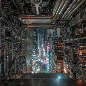 In the heart of a dense, metropolitan cityscape sits a stygian a...