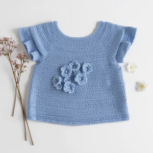 Create an elegant flat lay composition featuring a delicately ha...