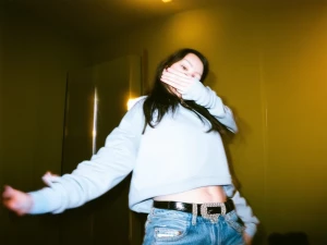 a lo-fi 2010s-era, diagonally taken, low-quality iPhone photo of...