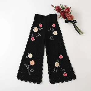 Create an elegant flat lay composition featuring a delicately ha...