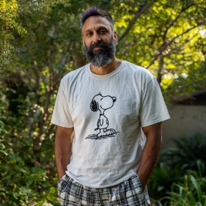 The image shows a 45 year old man with a beard black hair with s...