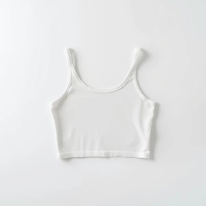 Produce an elegant flat lay image featuring a basic white crop t...