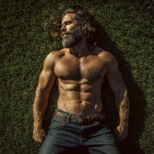 a beef bodybuilder man hairy chest beard with brown hair dark je...