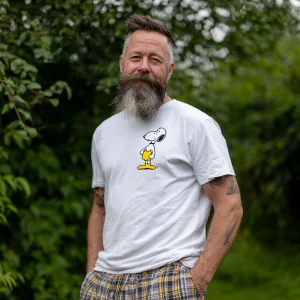 The image shows a 45 year old man bodybuilder with a beard brown...