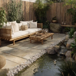 Create a serene outdoor lounge with minimalist bamboo furniture,...