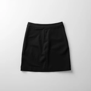 Create a minimalist flat lay composition with a classic black kn...