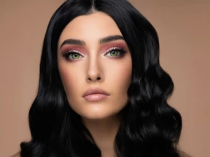 The person in the image is a woman with fair skin and a symmetri...